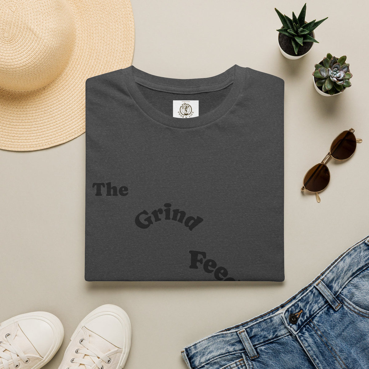 T-Shirt — “The Grind Feeds the Pockets” (Back) The Peace Feeds The Soul.