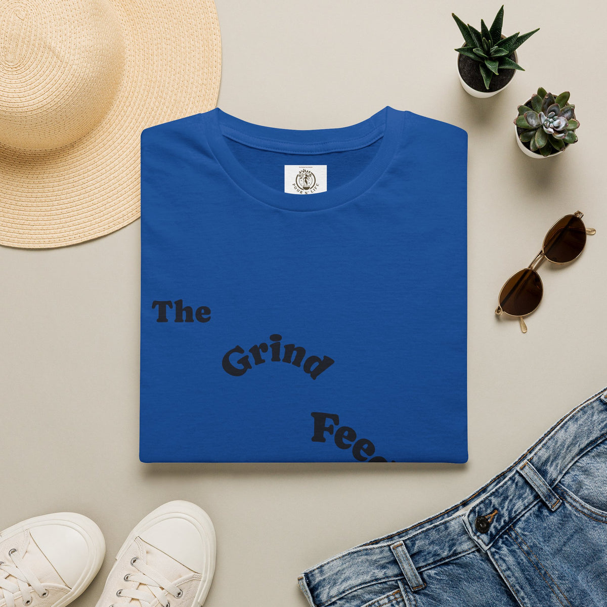 T-Shirt — “The Grind Feeds the Pockets” (Back) The Peace Feeds The Soul.