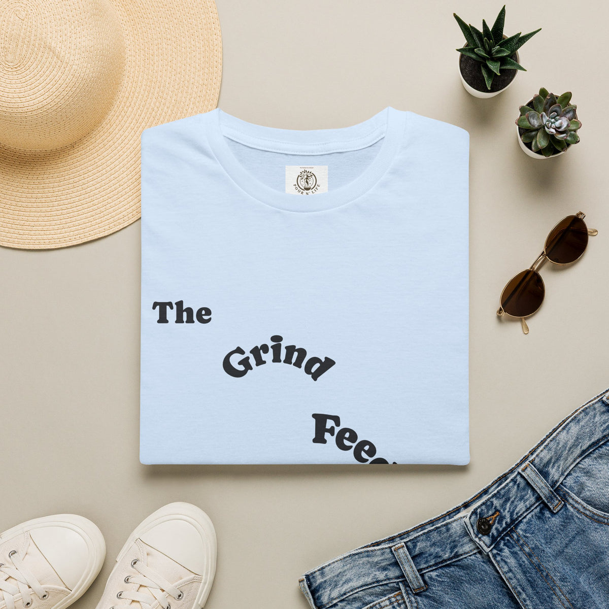 T-Shirt — “The Grind Feeds the Pockets” (Back) The Peace Feeds The Soul.